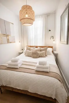 a bedroom with a large bed with towels on it at Cozy Little Italy Retreat Steps from SoHo in New York