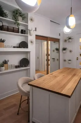 a kitchen with a island with a wooden counter top at Cozy Little Italy Retreat Steps from SoHo in New York