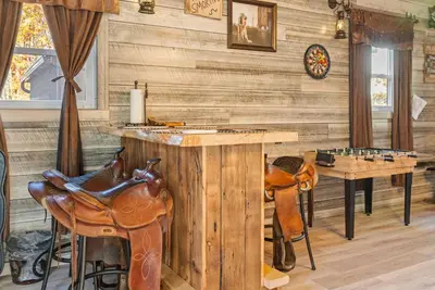 a game room with a table and a chess board at Lakefront with Beach Game Room Fire-pit and More in Blakeslee