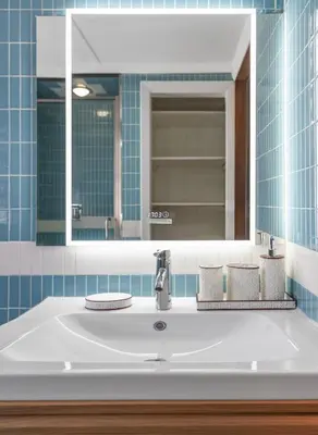 a bathroom with a white sink and a mirror at Charming Entire Home,18m to Manhattan, Home Theater in Carlstadt