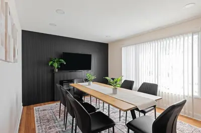 a dining room with a table and chairs at Charming Entire Home,18m to Manhattan, Home Theater in Carlstadt