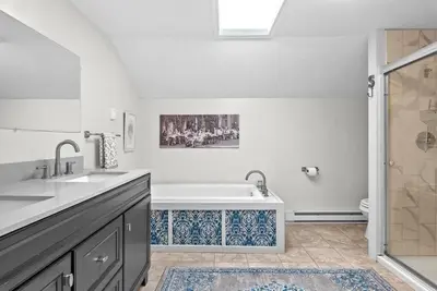 a bathroom with a tub and a sink and a toilet at Country Chic 3BR Retreat Near All Star Village in Treadwell