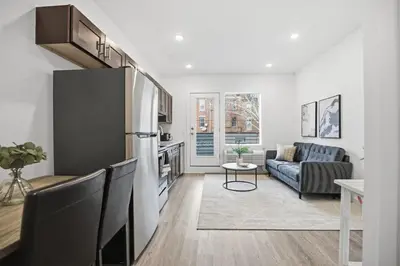 a living room with a couch and a table at 1BR1BA apartment in the Fairmount Square building in Philadelphia