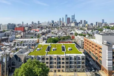 a building with a green roof on top of it at 1BR1BA apartment in the Fairmount Square building in Philadelphia