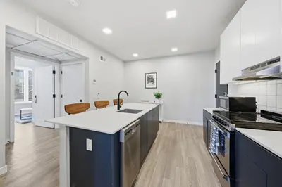 a kitchen with a sink and a counter top at Modern 2BR, 1BA Apartment in Great Location in Philadelphia