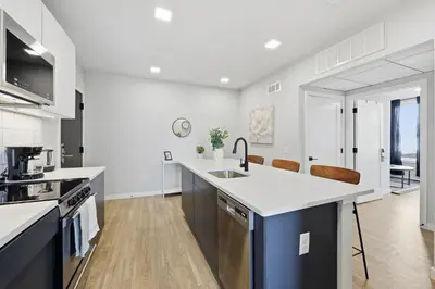 a kitchen with a sink and a counter top at Bright Modern 2BR Apartment in Prime Location in Philadelphia