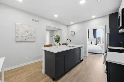 a kitchen with a sink and a counter top at Bright Modern 2BR Apartment in Prime Location in Philadelphia