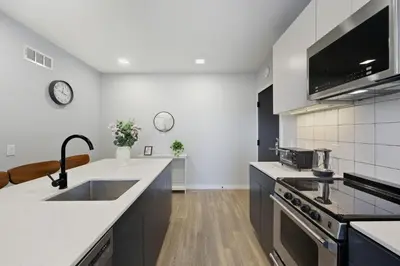 a kitchen with a sink and a counter top at Contemporary 2BR Apartment Near Everything in Philadelphia