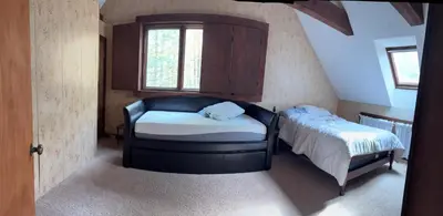 a small bedroom with a bed and a window at Ambro's Place in Lake Ariel