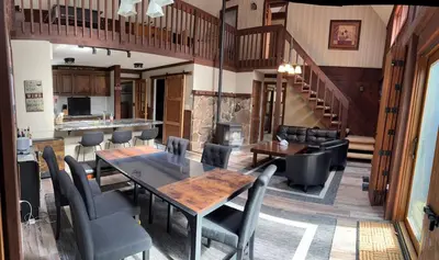 a dining room with a table and chairs at Ambro's Place in Lake Ariel