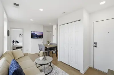 a living room with a couch and a table at Carriage House Stylish 1BR Retreat in Philadelphia