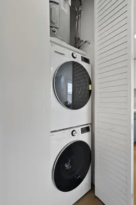 two washing machines stacked on top of each other at Carriage House Stylish 1BR Retreat in Philadelphia