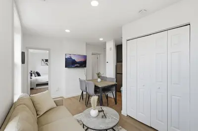 a living room with a couch and a table at Carriage House Stylish 1BR Retreat in Philadelphia