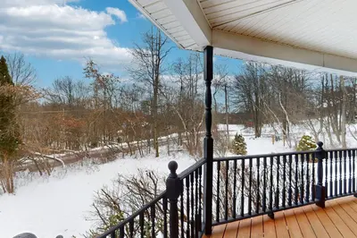 a porch with snow on the ground at The Nest in Long Pond