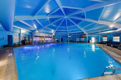 a large swimming pool with a blue ceiling at The Nest in Long Pond