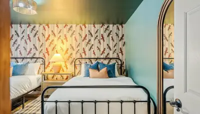 a bedroom with a bed and a mirror at Epic Poconos Pad - Pool - Hot Tub - Gym - Golf Sim in East Stroudsburg