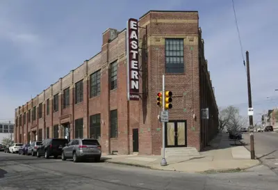 a brick building on a street with a traffic light at Sleek apartment with modern amenities in Philadelphia
