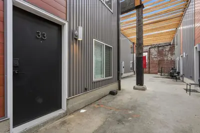 a black door on the side of a building at Sleek city apartment with modern finishes in Philadelphia