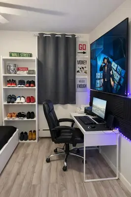 an office with a desk with a computer and a monitor at Minimalist Midtown West Studio in Central Manhattan in New York