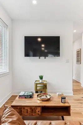a living room with a wooden coffee table at Modern 3BR Walk to Museums in Philadelphia
