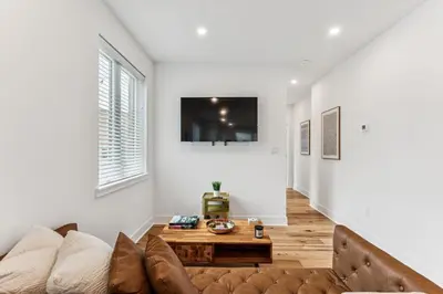 a living room with a couch and a table at Modern 3BR Walk to Museums in Philadelphia