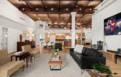 a living room with a couch and a table at Sun-Filled Luxury Historic 2 Bedrooms apto in New York