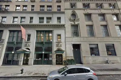 a silver car parked in front of a building at Sun-Filled Luxury Historic 2 Bedrooms apto in New York