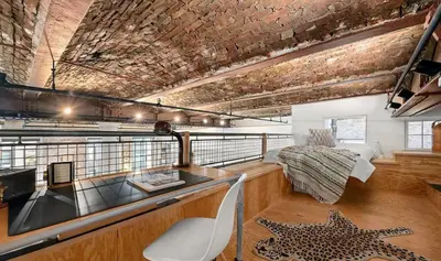 a room with a desk and a bed in a room at Sun-Filled Luxury Historic 2 Bedrooms apto in New York