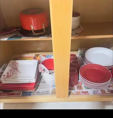 a cabinet filled with plates and bowls and dishes at Comfortable 3BR, 2BA Perfect for Families! in Mechanicsburg