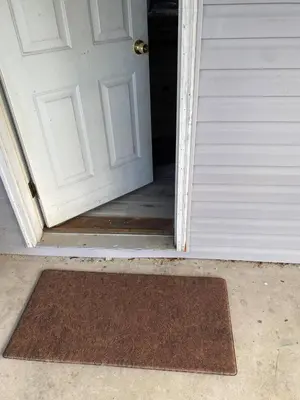 an open door with a mat in front of it at Comfortable 3BR, 2BA Perfect for Families! in Mechanicsburg