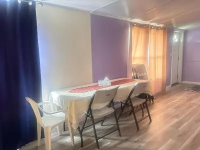 a dining room with a table and chairs at Comfortable 3BR, 2BA Perfect for Families! in Mechanicsburg