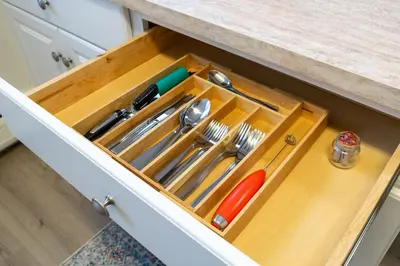 a drawer in a kitchen with utensils at The Hamilton Elm in Teaneck