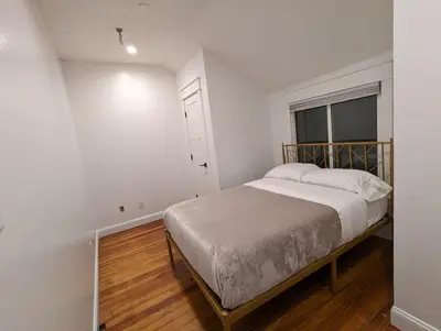 a bedroom with a bed and a window at Carriage House Apartment Close to Legoland NY in Goshen