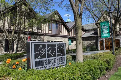 a sign in the grass in front of a house at Hay Loft in Historic Barn - 4 Minutes to Legoland in Goshen