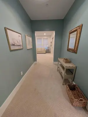 a room with blue walls and a table and a mirror at Parkway House Goshen Bed And Breakfast Suite 3 in Goshen
