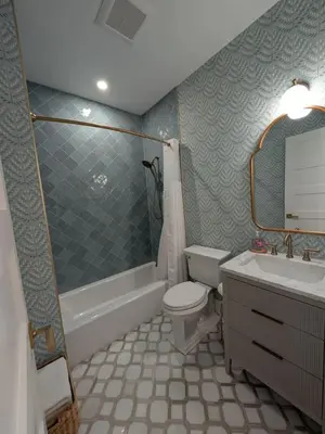 a bathroom with a toilet and a tub and a sink at Parkway House Goshen Bed And Breakfast Suite 3 in Goshen