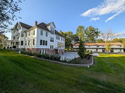 a large white house with a large yard at Parkway House Goshen Bed And Breakfast Suite 3 in Goshen