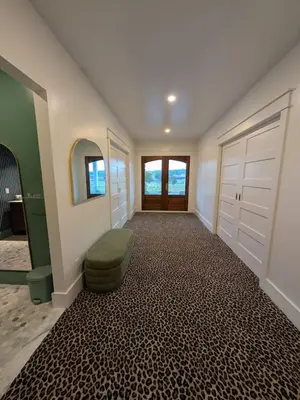a hallway with a room with two white doors at Parkway House Goshen Bed And Breakfast Suite 2 in Goshen