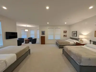a bedroom with two beds and a living room at Parkway House Goshen Bed And Breakfast Suite 2 in Goshen
