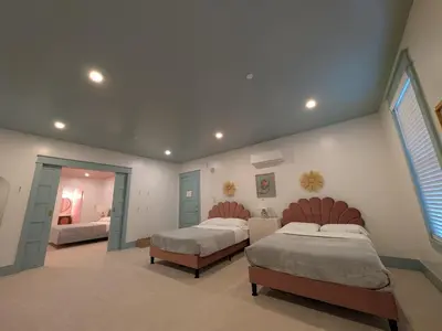 a large bedroom with two beds and a window at Parkway House Goshen Bed And Breakfast Suite 1 in Goshen
