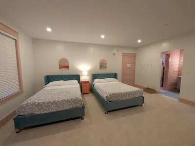 a bedroom with two beds and a hallway at Parkway House Goshen Bed And Breakfast Suite 4 in Goshen