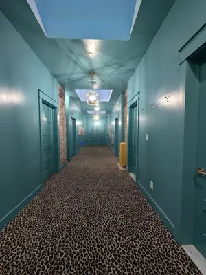 an empty hallway with blue walls and a ceiling at Parkway House Goshen Bed And Breakfast Suite 5 in Goshen