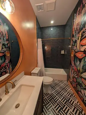 a bathroom with a sink and a toilet and a tub at Parkway House Goshen Bed And Breakfast Suite 5 in Goshen