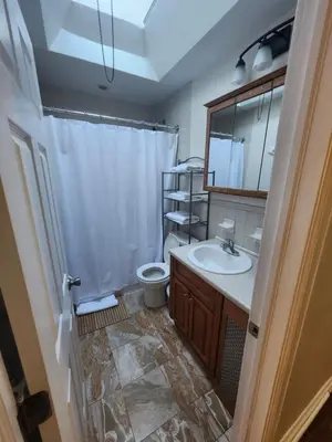 a bathroom with a sink and a toilet and a mirror at Lansdowne Gem in Lansdowne