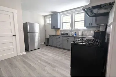 a kitchen with a stove and a refrigerator at Cozy 3 Bedrooms Spacious Comfort in Orange