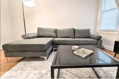 a living room with a couch and a coffee table at Cozy 3 Bedrooms Spacious Comfort in Orange