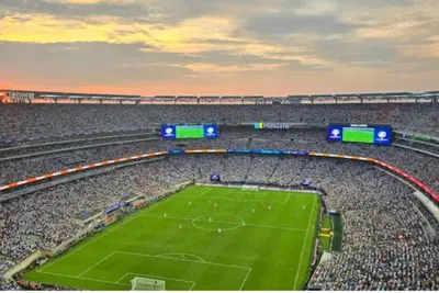 an empty soccer stadium with a green field at Cozy 3 Bedrooms Spacious Comfort in Orange
