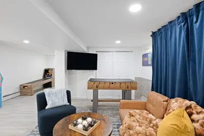 a living room with a couch and a table at The Harper Loft in Hoboken