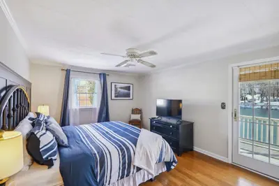 a bedroom with a bed and a ceiling fan at The Riverfront in Easton