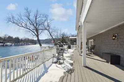 a porch of a house with a view of the water at The Riverfront in Easton
